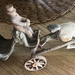 Antique horse drawn carriage with driver and passenger. Metal art , Christmas, vintage