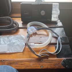 c-pap sleep machine. Resumed Air sense -10 with humid air including all necessary attachments plus heater hose-filters-nasal pillows with headgear 