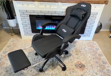 Black gaming chair with footrest