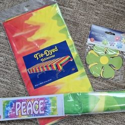 Tie dye hippie party supplies 1960s Theme table cover, peace banner, retro flower mini cutouts.