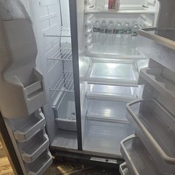 Stainless Steel Whirlpool Refrigerator w/ working ice  & water dispenser