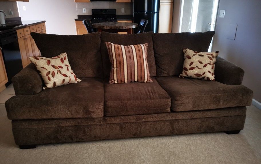 Sofa with pillows included in excellent condition