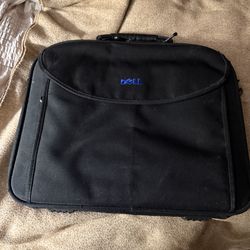 COMPUTER BAG. 17"w x 13 1/2"tall; cross streets are Arapaho & Waterview