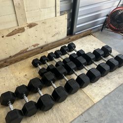 New pair of 15,20,25,30,45,50,55 and 60lb rubber dumbbells NEW IN BOX $600