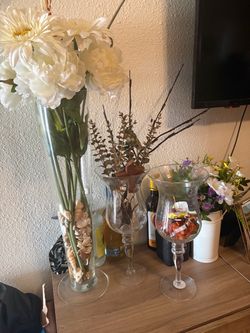 Three glass vases, one is tall