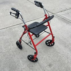 Red Metal Walker With Seat And Brakes