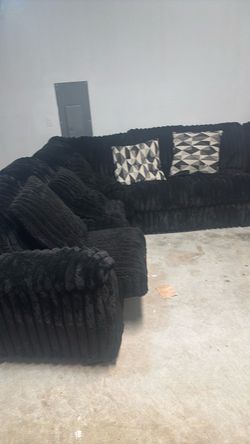 Black Plush Sectional Sofa with Throw Pillows
