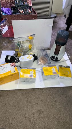 Medela Breast Pump and accessories plus lactation massager and BabyBrezza