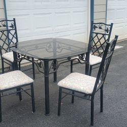 Dining room table and 4 chairs glass top 