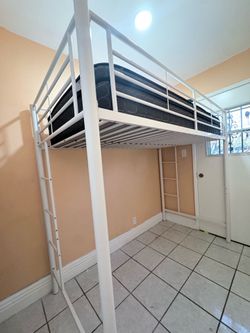 Metal twin loft with mattress