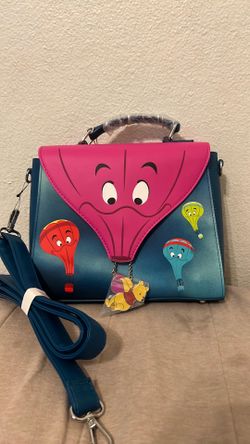 Winnie the Pooh Disneyland purse with adjustable straps Winnie the Pooh Disneyland backpack with adjustable straps