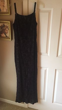 Shimmery bodice long black dress. The back is cut lower than the front! Women’s size 10! Looks lovely with high heels......