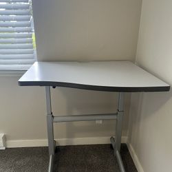 Adjustable sit‑stand desk