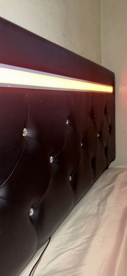 Full sized bed frame for sale! Comes with LED lights on the head board.