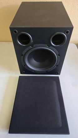 Black Subwoofer with Removable Grille and a center channel speaker