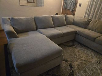 Sofa, rug and painting