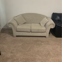 beige couch with pillows. NEED GONE ASAP. 
