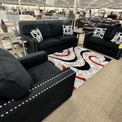 Chic and Comfy Black Sofa with Silver Accents