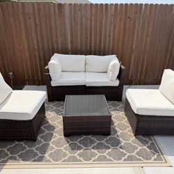 Outdoor Patio set with table and carpet.