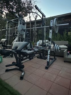 OLYMPIC SQUAT RACK WITH OLYMPIC WEIGHTS AND BENCH