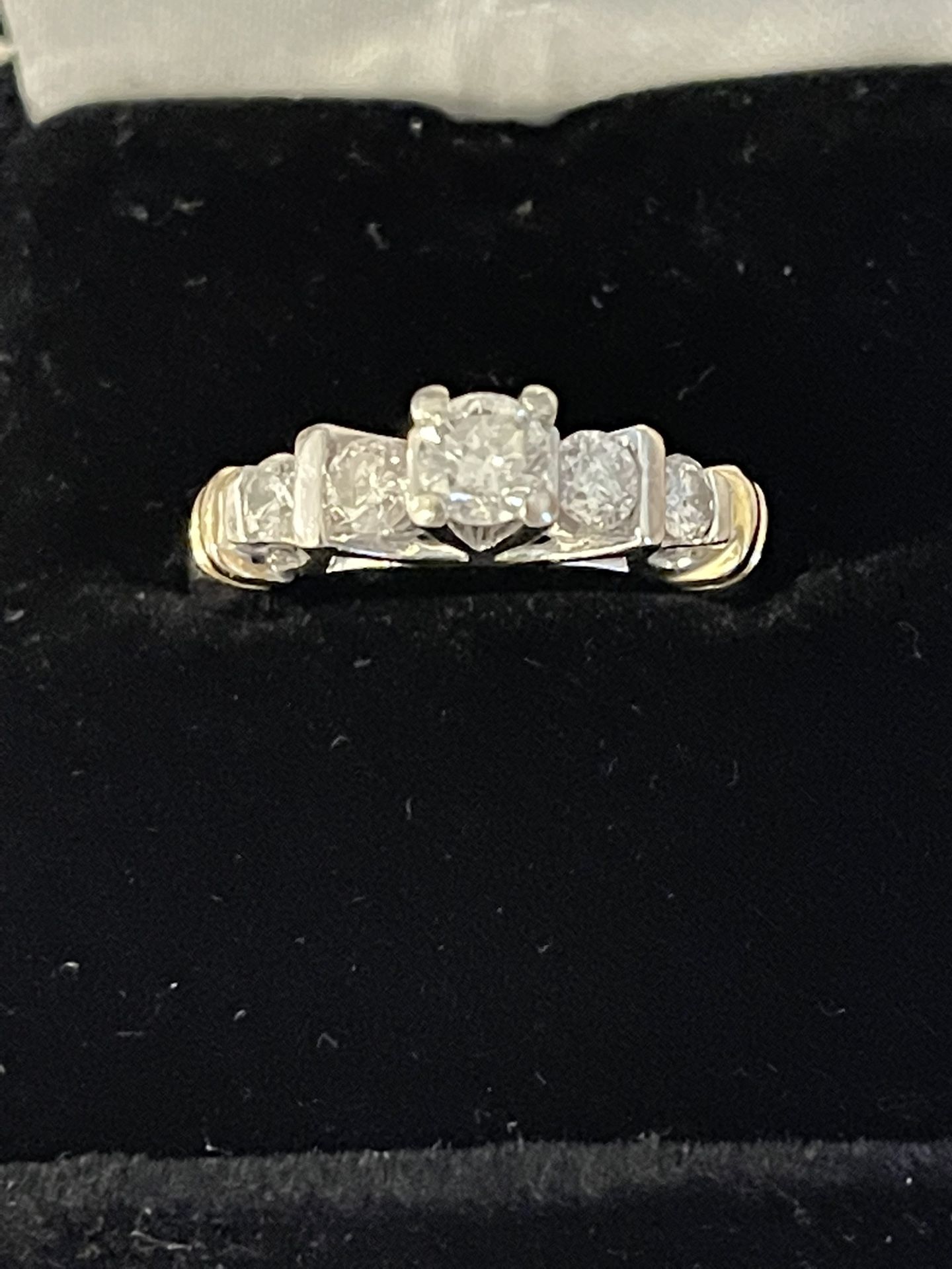 stunning ladies' ring is crafted from 14 KT white and yellow gold and features beautiful 1 CT total weight natural diamonds.