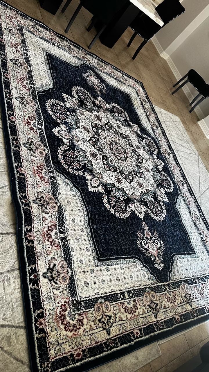 two carpets each with pictures