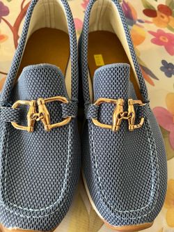 Women’s Blue slip on with gold tone buckle. Size 9