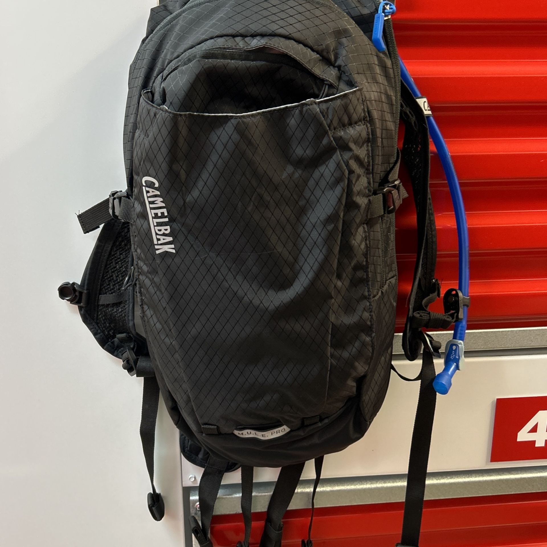 The Camelbak MULE Pro 14 hydration backpack, with a 3 litre tank, is designed for E-Bike users. It is made of lightweight materials