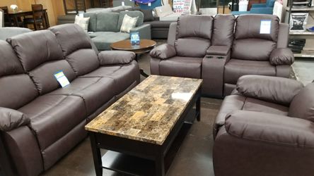 Brown leather reclining sofa and loveseat
