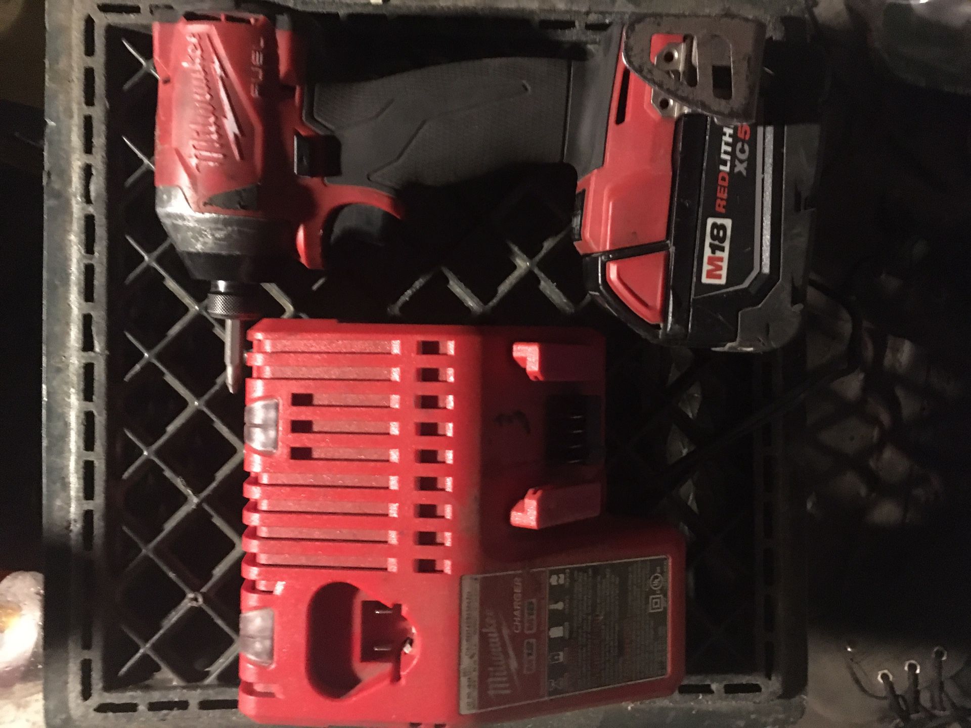 Milwaukee impact drill with charger