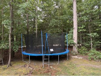 Large trampoline with safety net