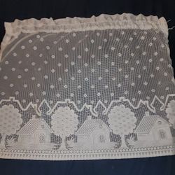 White Lace curtain for a small rod. Only one panel here 30 W x 26 L  little houses gives it a country look. East or West