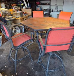 Patio table with a fractured technique and a hole for umbrella and 4 chairs