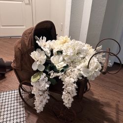 vintage baby stroller with artificial white flowers $150