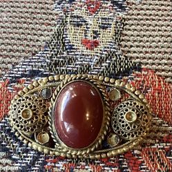 Intriguing, Vtg. Brooch, carnelian red stone and interesting filigree.