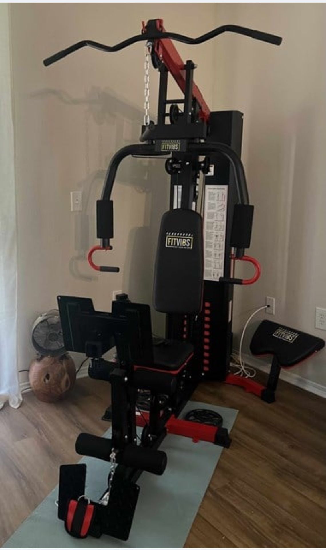 Home gym machine with attachments