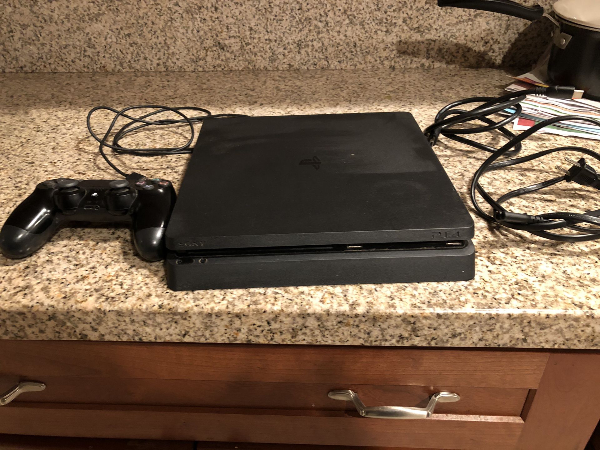 PS4 with controller and cables