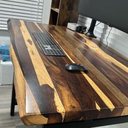 Standing desk with monitor and bookcase