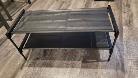 Brand new just assembled black two shelf shoe rack