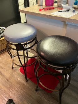 Swiveling barstools good condition has cover on them of grey color or the original is brown. Only asking $40 for set