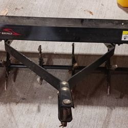 Brinly 40 inch tow behind lawn aerator. 