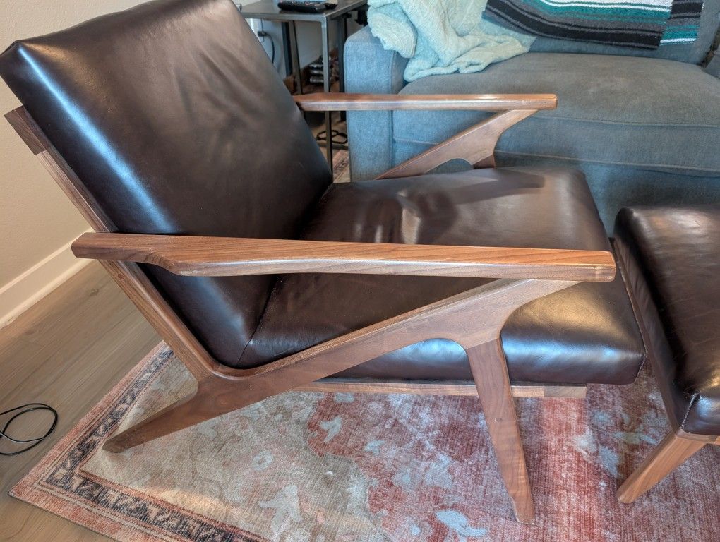 Crate And barrel chair And ottoman.