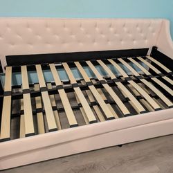 Light pink twin daybed with trundle