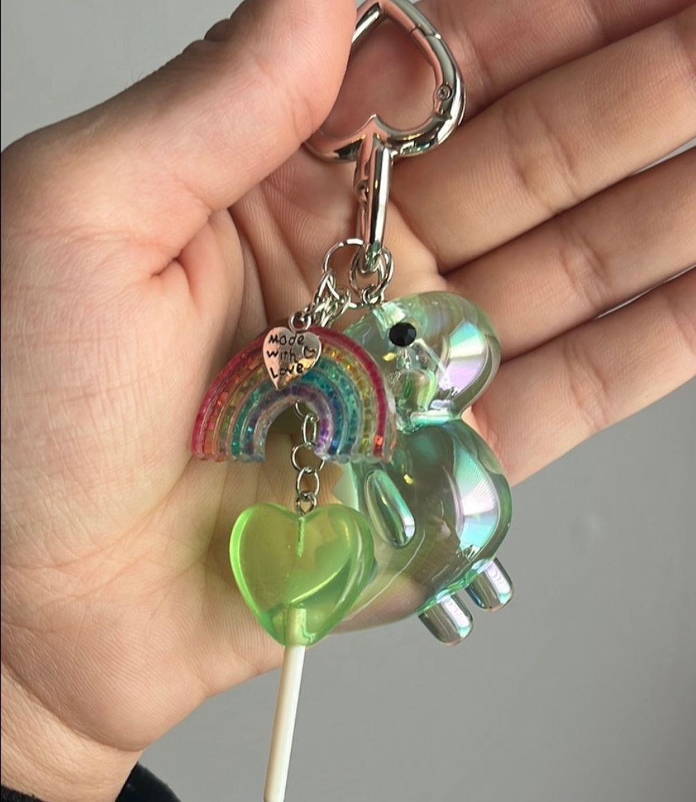 Iridescent green Dinosaur Keychain with Rainbow and candy Charms