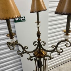 Maitland Smith candelabra-style floor lamp, likely from the late 20th century, featuring a metal frame with a brass or bronze finish and leather shade