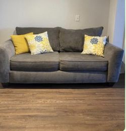 Grey Sofa With Decorative Pillows
