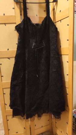 Gothic black velvet dress with lace trim and a front lace-up corset detail. This size 26 garment is from the Disney The Nightmare Before Christmas col