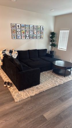 Sectional couch with coffee table.