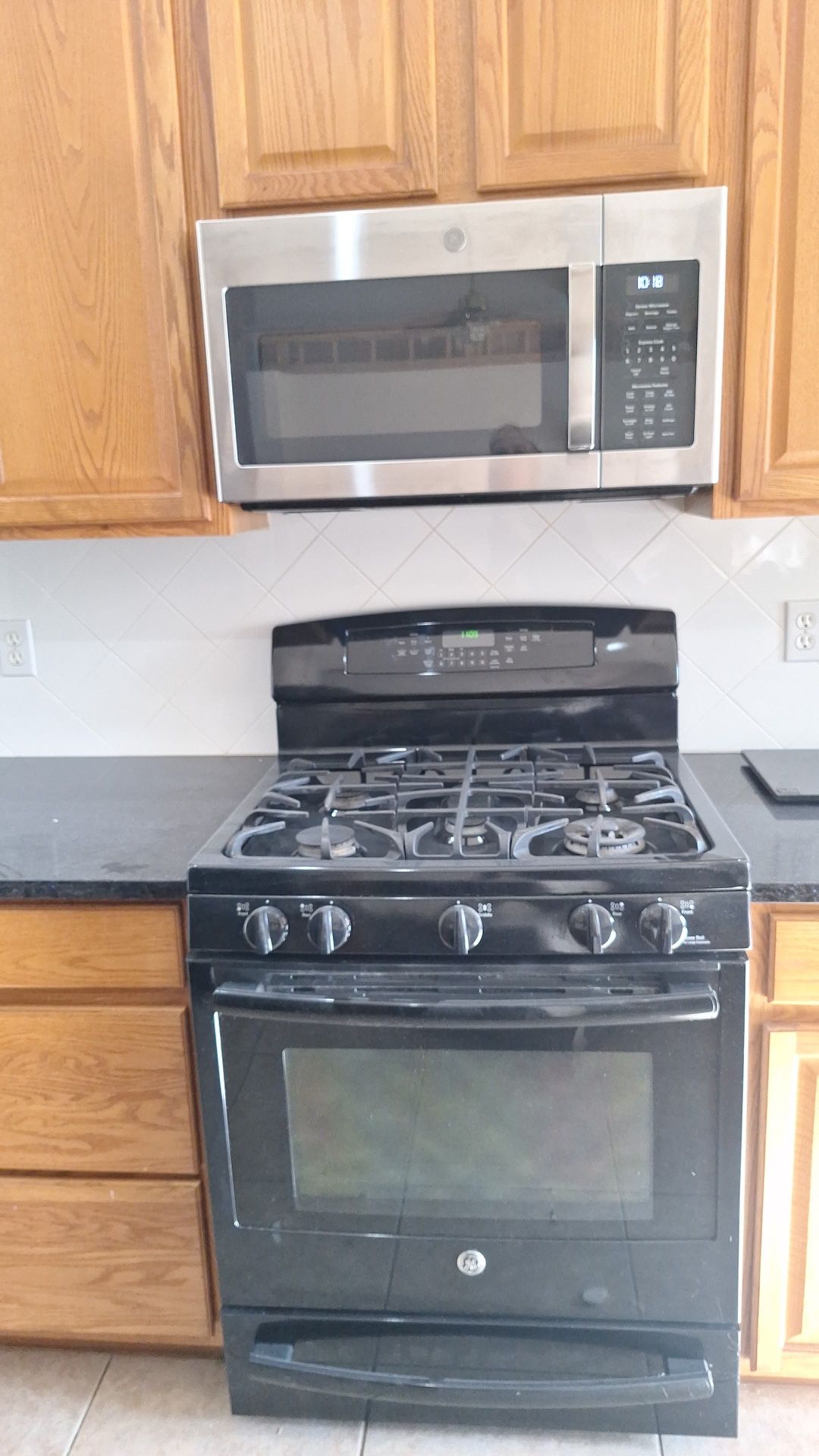 Gas Stove Black And Microwave Stainless Steel 30”