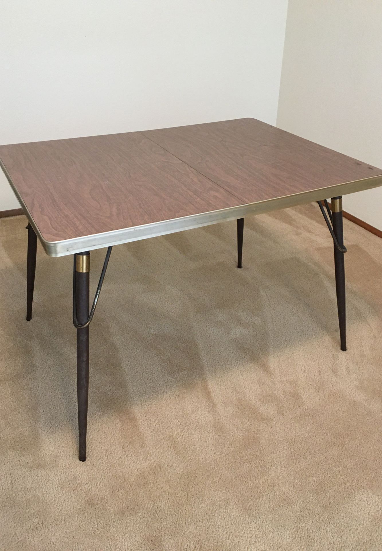 Midcentury modern, Vintage table. Formica top in wood grain pattern, metal legs